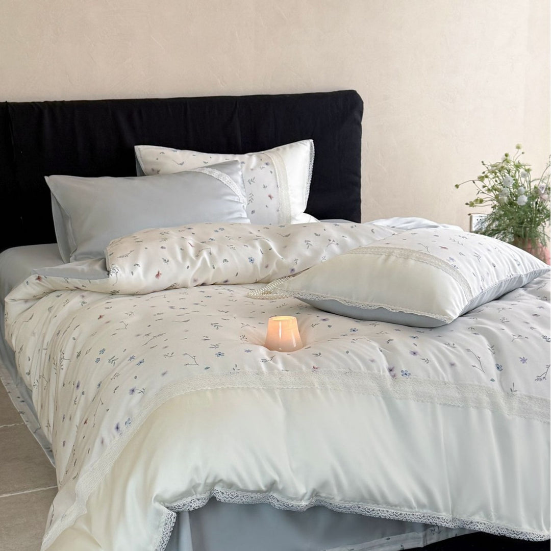 Cotton satin bedding set with delicate floral embroidery and lace trim
