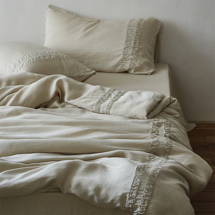 Linen bedding set with stonewash finish and delicate ruffle inserts