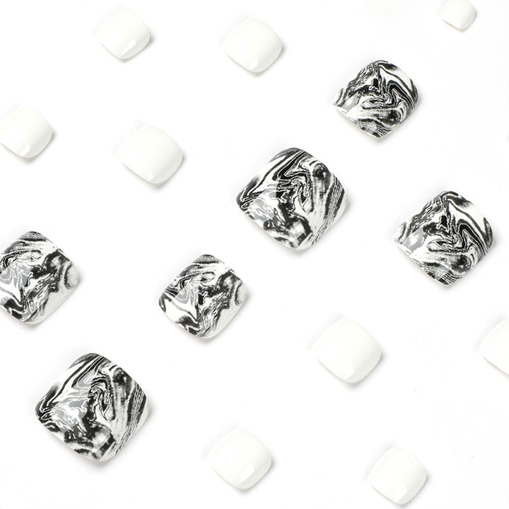 Artful toenail art in elegant marble design Kalsten