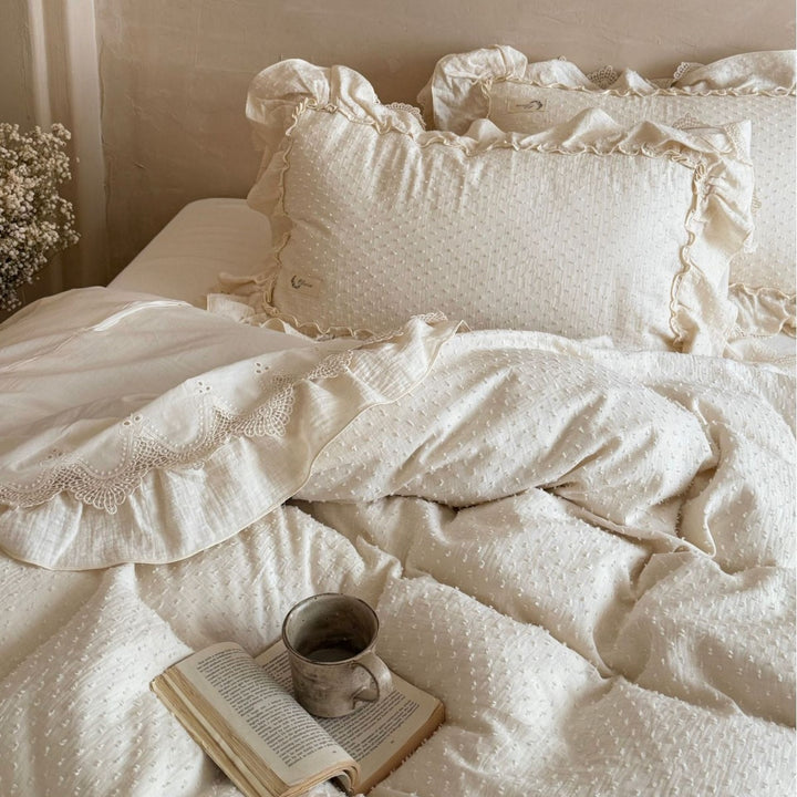 Bedding set in Shabby Chic with textured polka dot look, multi-layered ruffle, and lace finish