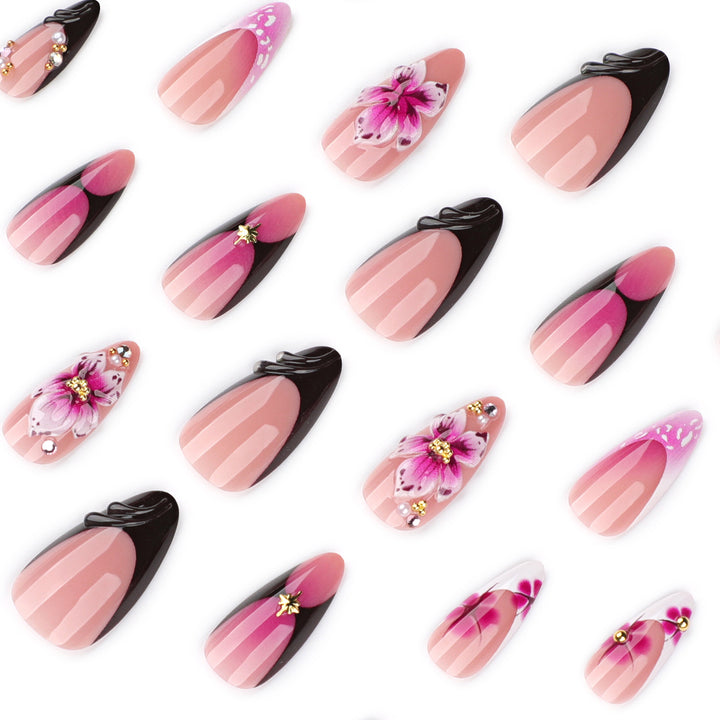 Artful stiletto nails with blooming design and glitter accents Kalsten