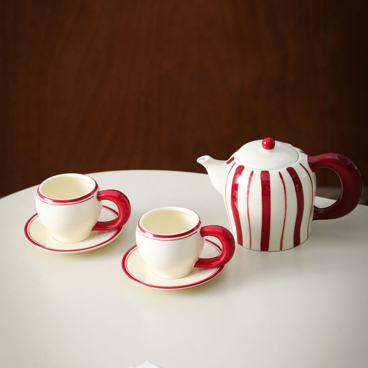 Porcelain tea set with vertical stripe decor and ergonomic handles