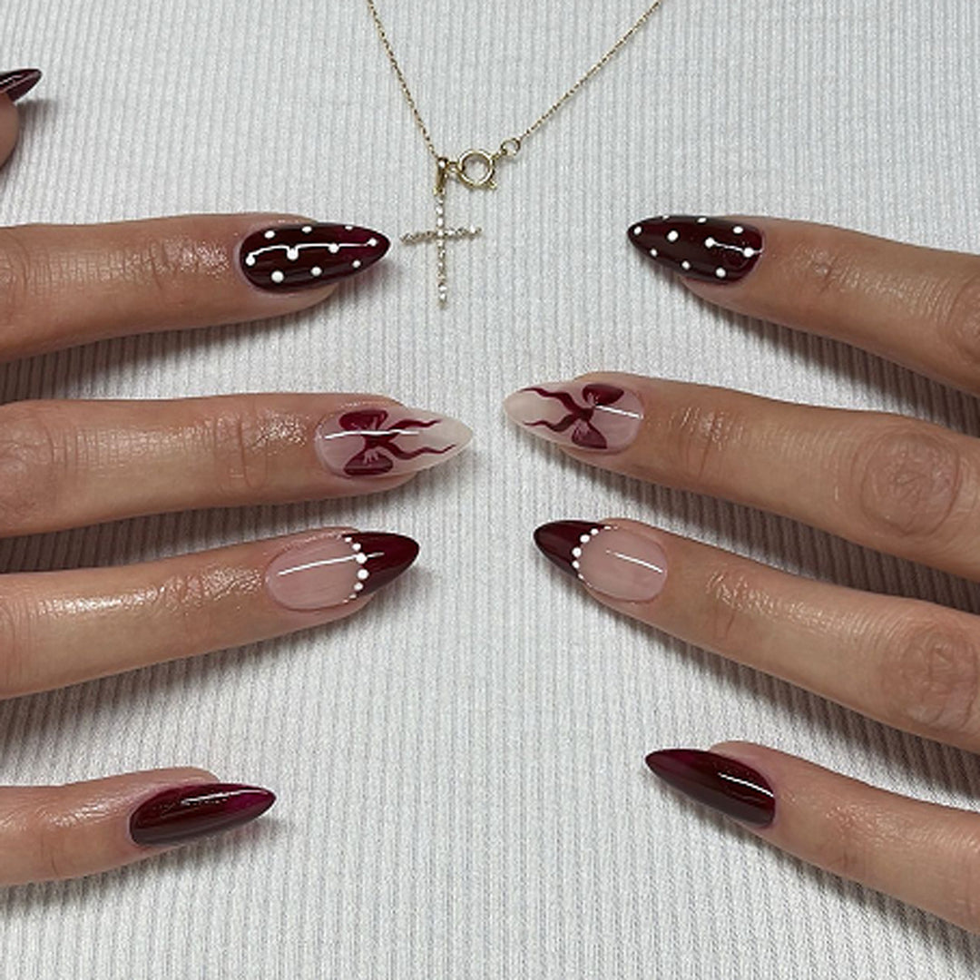 Elegantly designed stiletto nails with artistic accents Kalsten