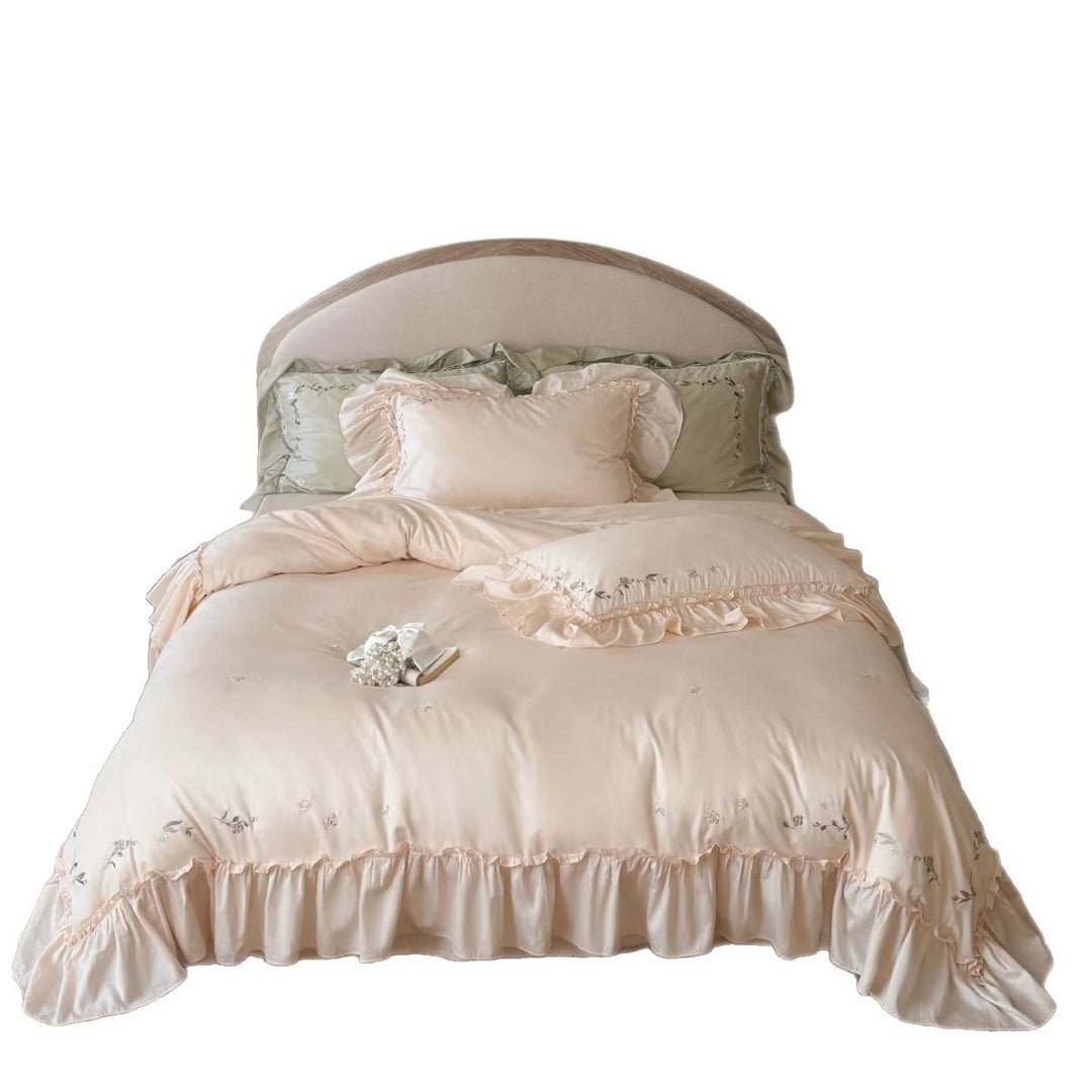 Elegant bedding set made of cotton satin with ruffles, delicate floral embroidery, and frills