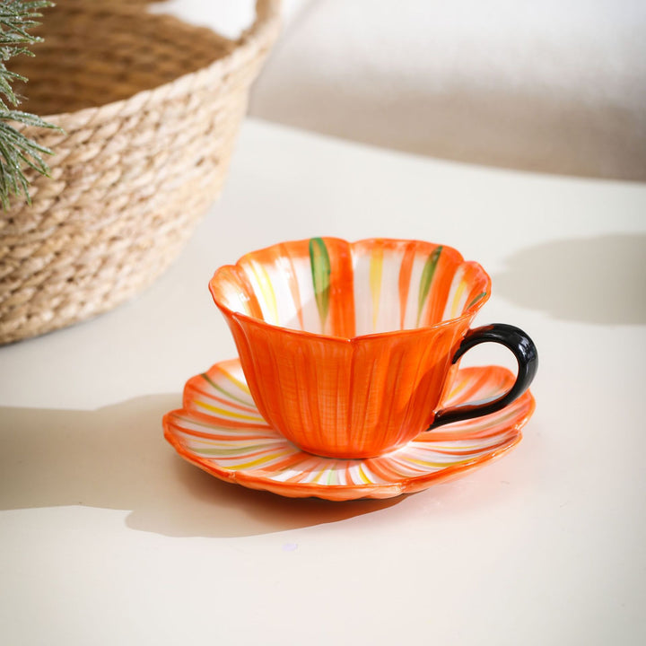 Handcrafted ceramic mug with shell-shaped wave edge and contrasting handle