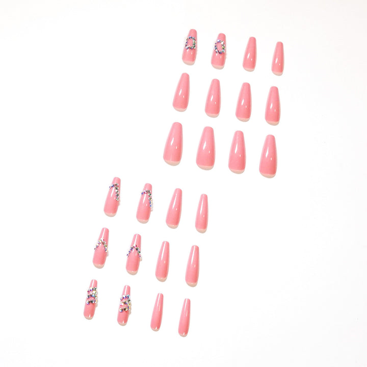 Artificial nail extensions with elegant rhinestone embellishments Kalsten