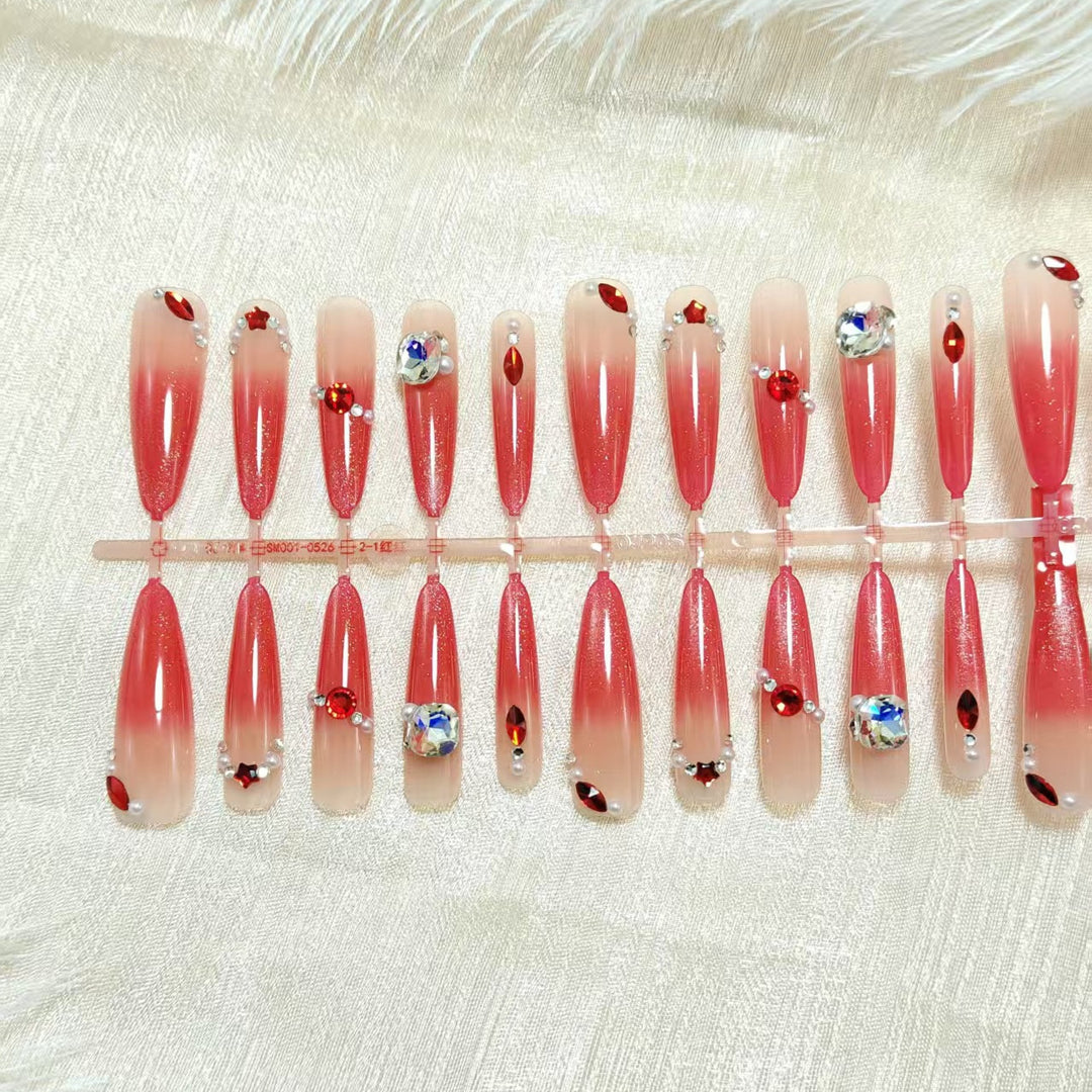 Glamorous artificial nails with sparkling ombre effect and elegant embellishments Kalsten