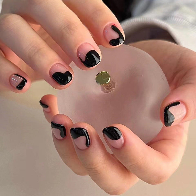 Artful nail art with elegant wave pattern and modern accents Kalsten
