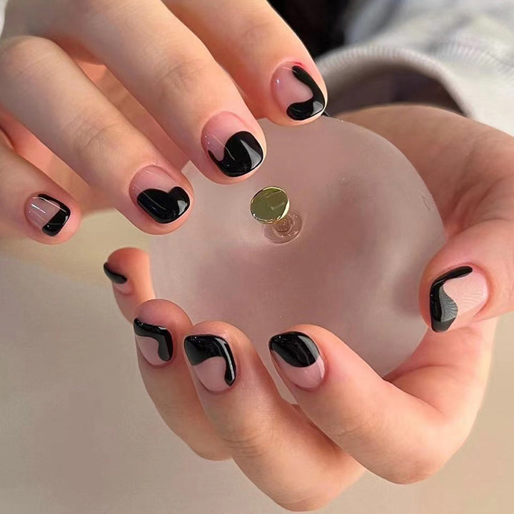 Artful nail art with elegant wave pattern and modern accents Kalsten