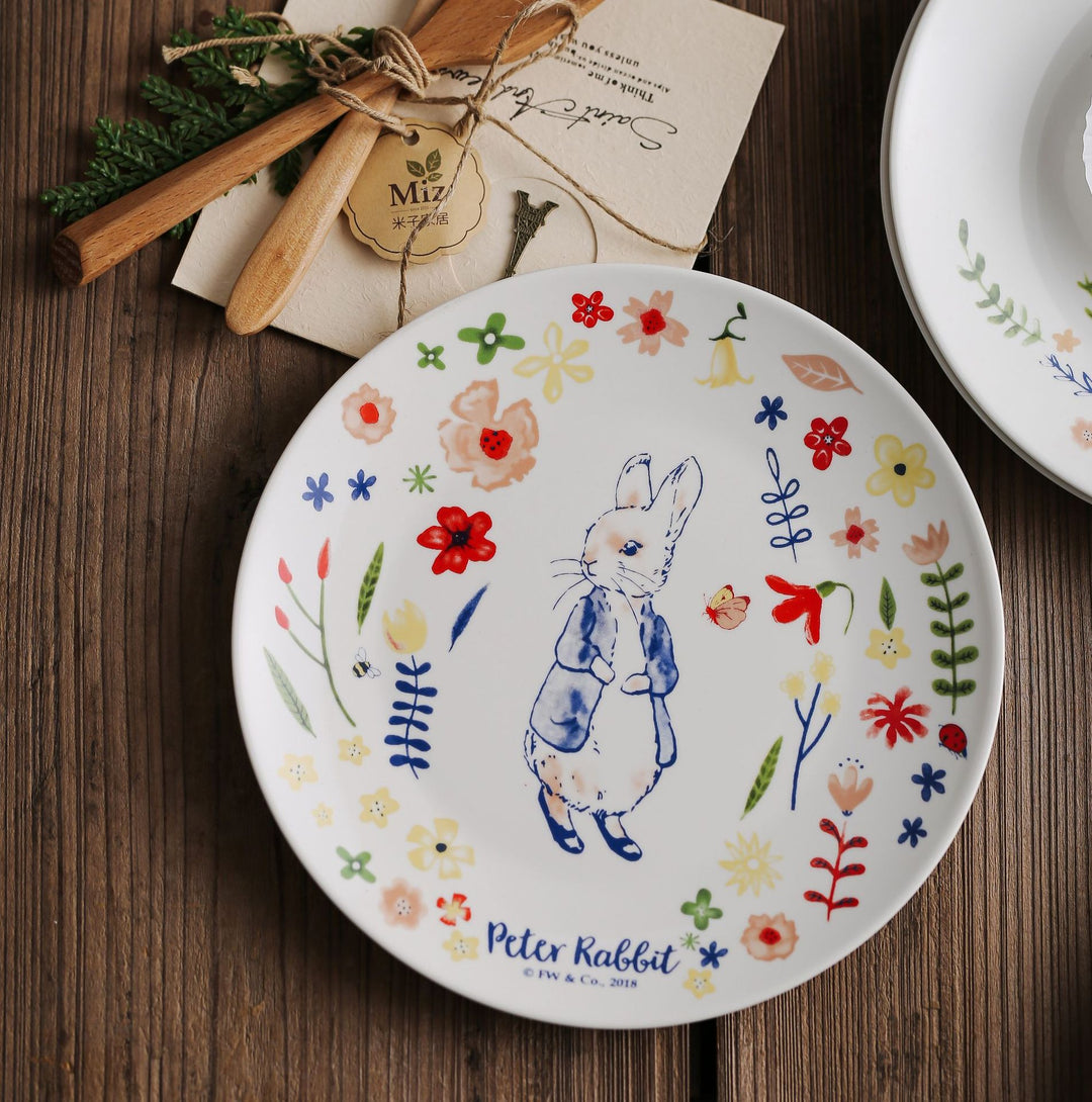 Children's plate made of porcelain with rabbit illustration and floral decoration