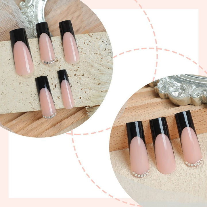 Nail set with elegant black and white colors and glitter accents Kalsten