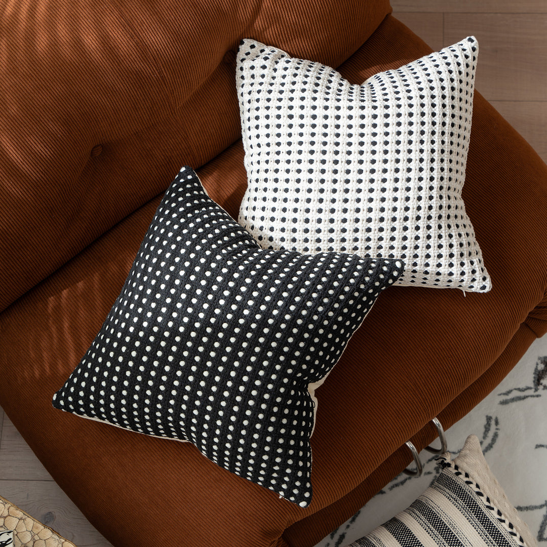 Woven decorative pillow with textured dot tufting