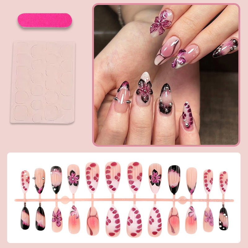 Acrylic nail set with elegant floral design and glossy accents Kalsten