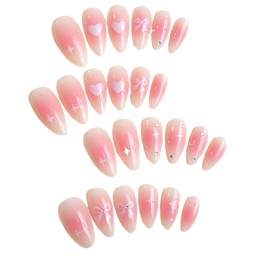Acrylic nail set with romantic heart and bow design Kalsten