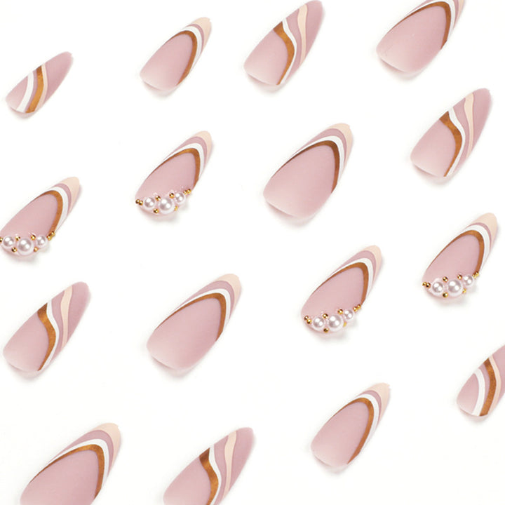 Artful stiletto nails with elegant gold and white accents Kalsten