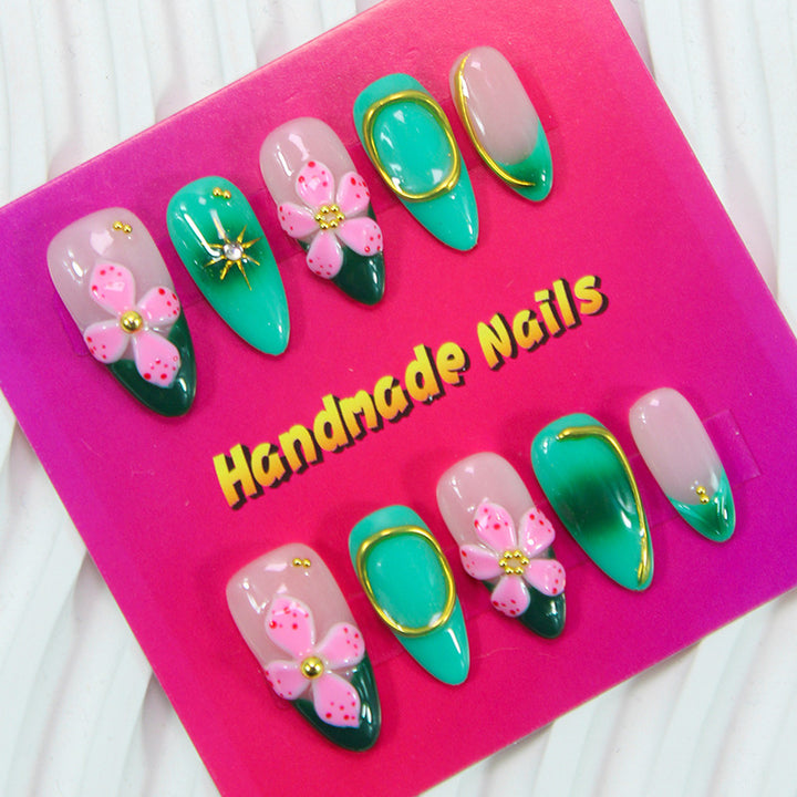 Artificial nails with floral accents and glitter decorations Kalsten