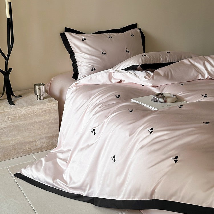Luxurious satin bedding set with cherry embroidery and contrasting trim