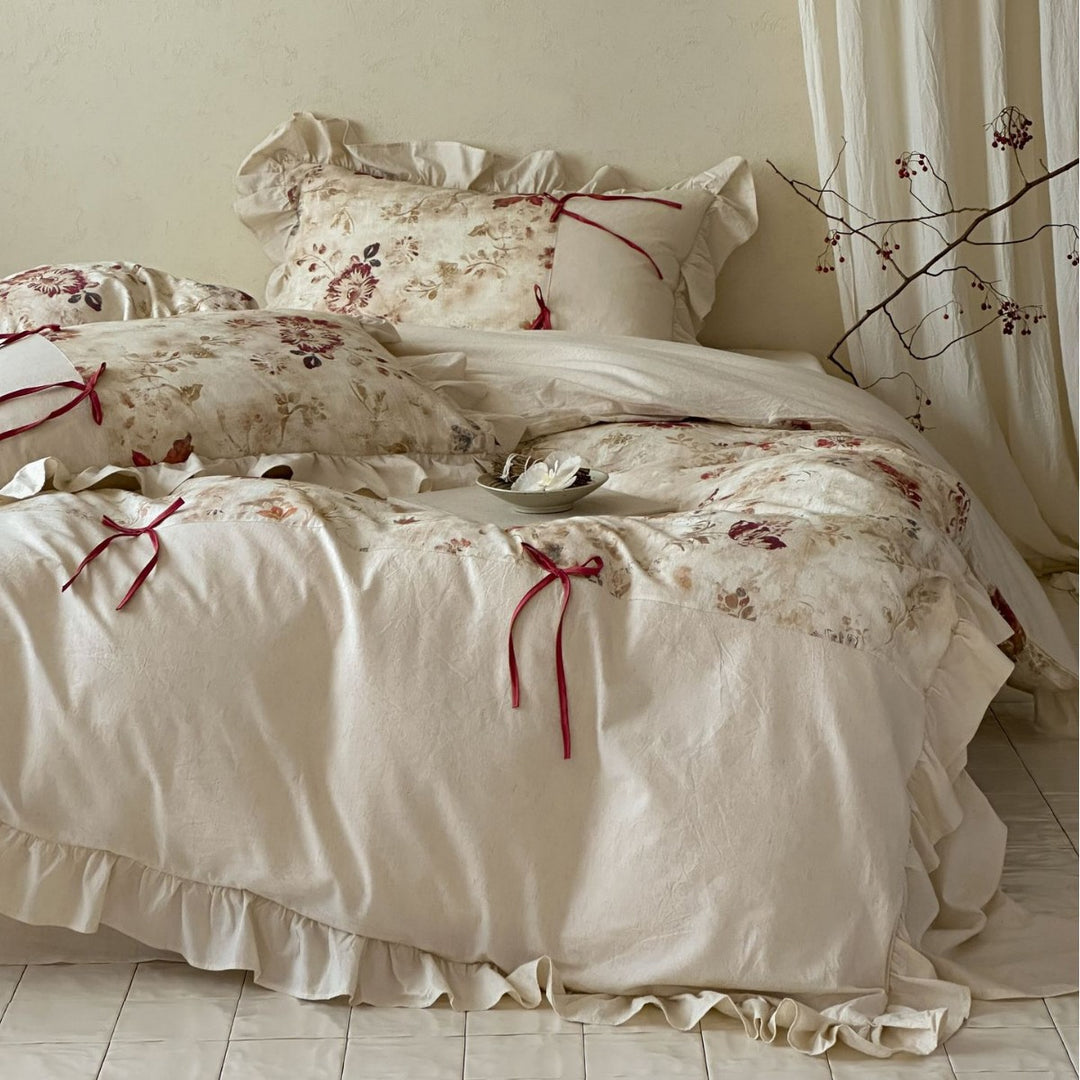 Duvet cover set made of cotton satin with watercolor magnolia print, ruffle, and tie ribbons