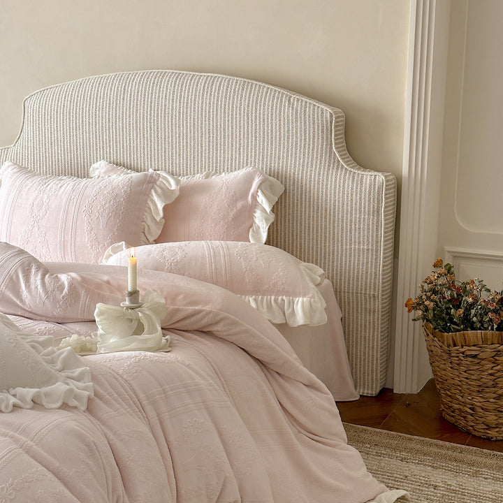 Quilted bedding set with ruffle and medallion relief