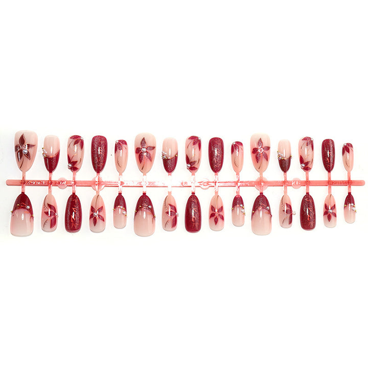 Glamorous artificial nail set with elegant floral and glitter details Kalsten