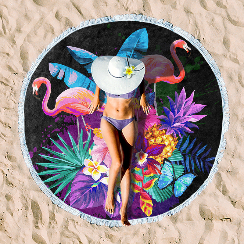 Round beach towel with colorful, tropical floral pattern and fringe decoration Kalsten