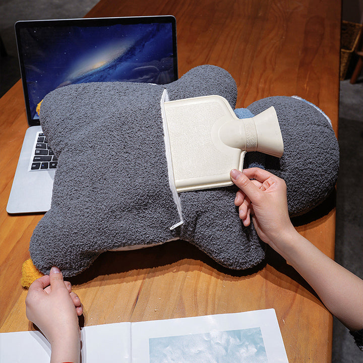 Cozy plush pillow with integrated blanket in penguin look