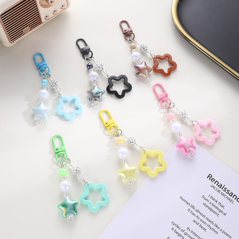 Playful keychain with floral and star motif Kalsten