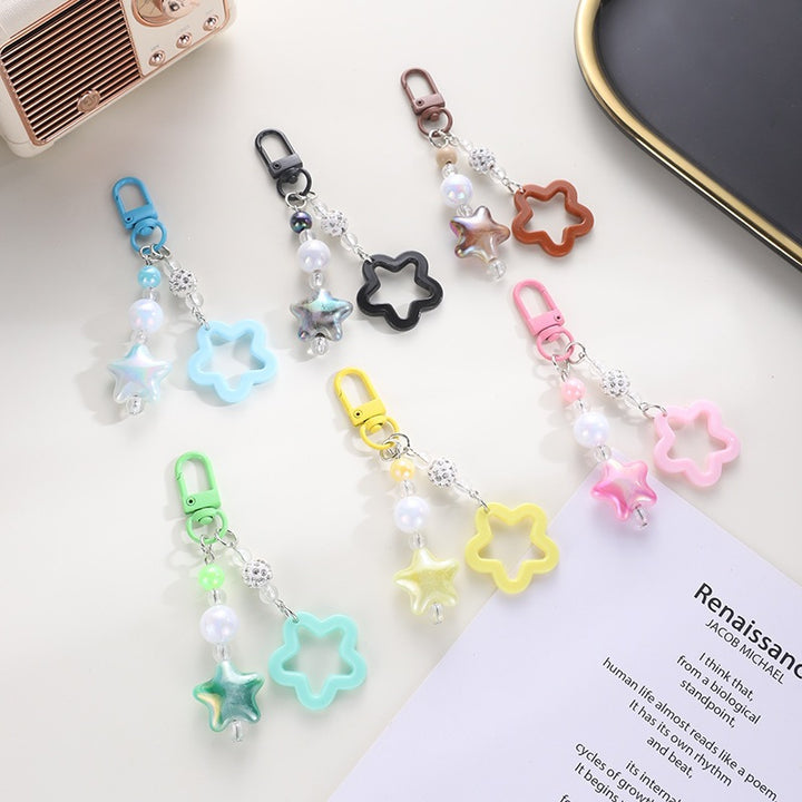 Playful keychain with floral and star motif Kalsten