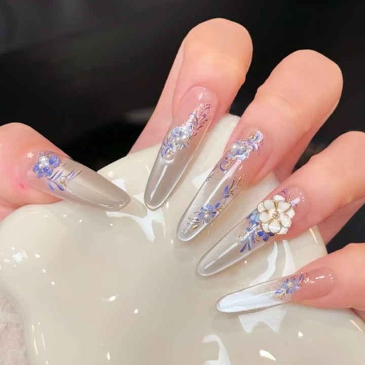 Acrylic nail set with elegant tips and glamorous rhinestone accents Kalsten
