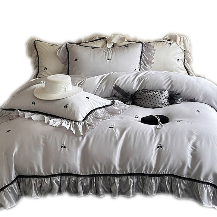 Silk-gloss satin bedding set with ruffled trim and delicate cherry embroidery