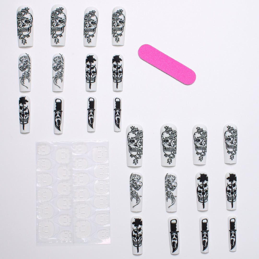 Nail set with spooky skull design and floral motifs Kalsten
