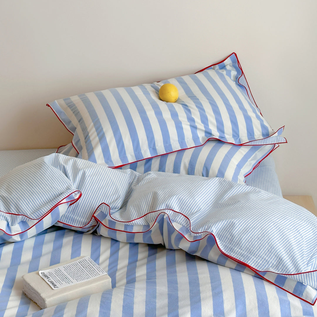 Striped duvet cover and pillowcase set with contrast piping