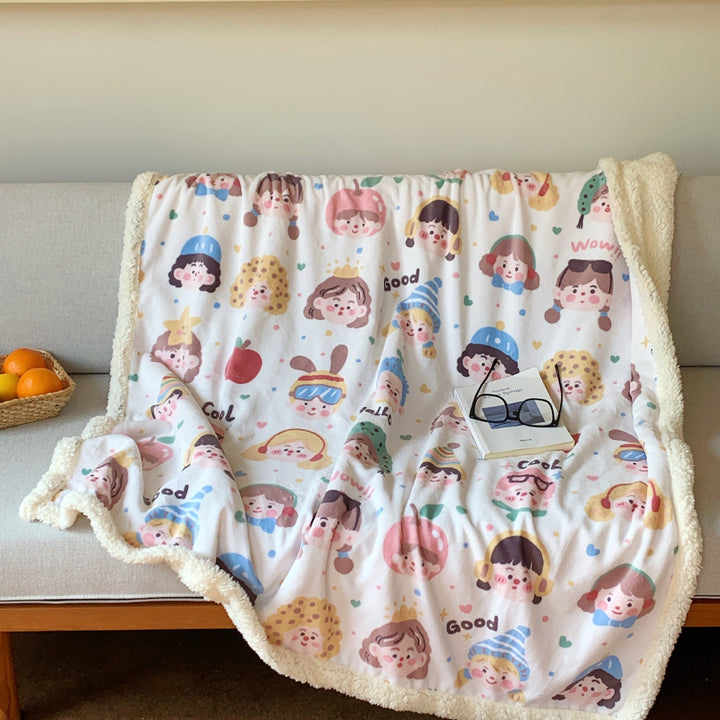 Reversible fleece blanket with cartoon cat design and teddy lining