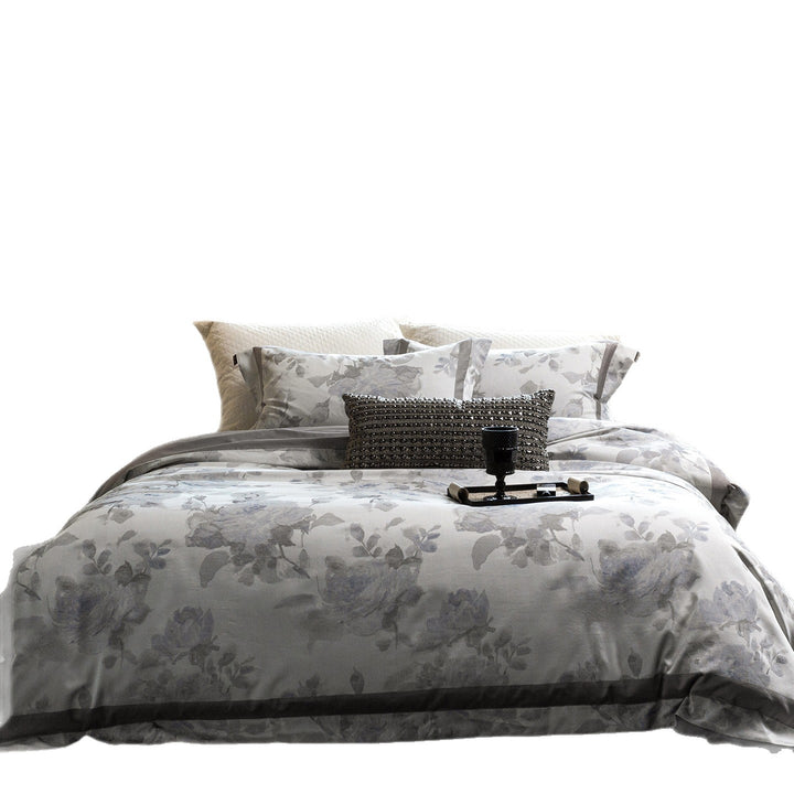 Cotton satin duvet cover set with delicate watercolor floral print, piped edge and matching pillowcases