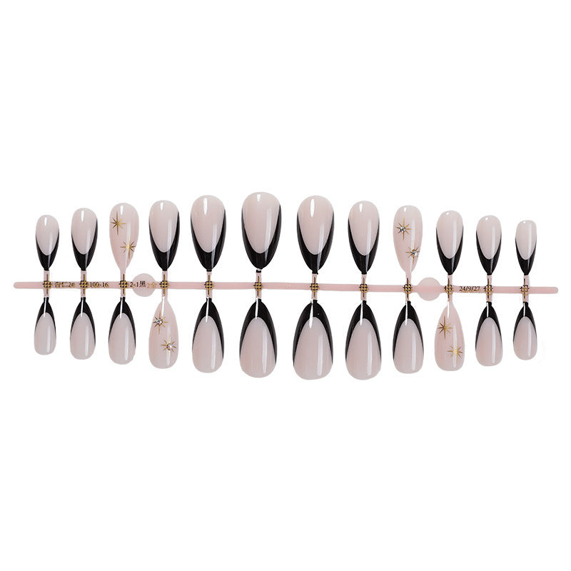 Acrylic nail set with elegant black accents and glamorous details Kalsten