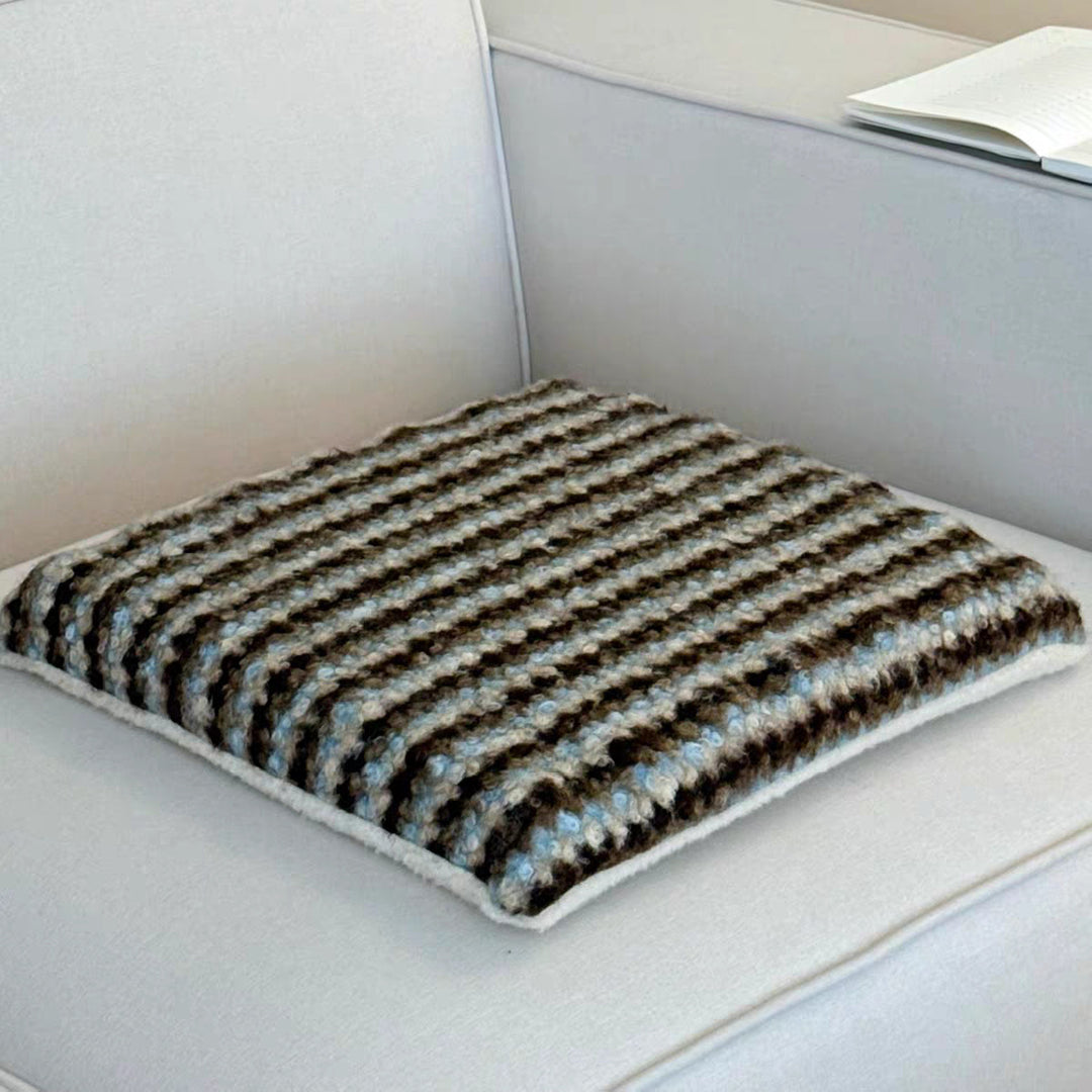 Knitted decorative cushion with wool blend and retro stripe texture