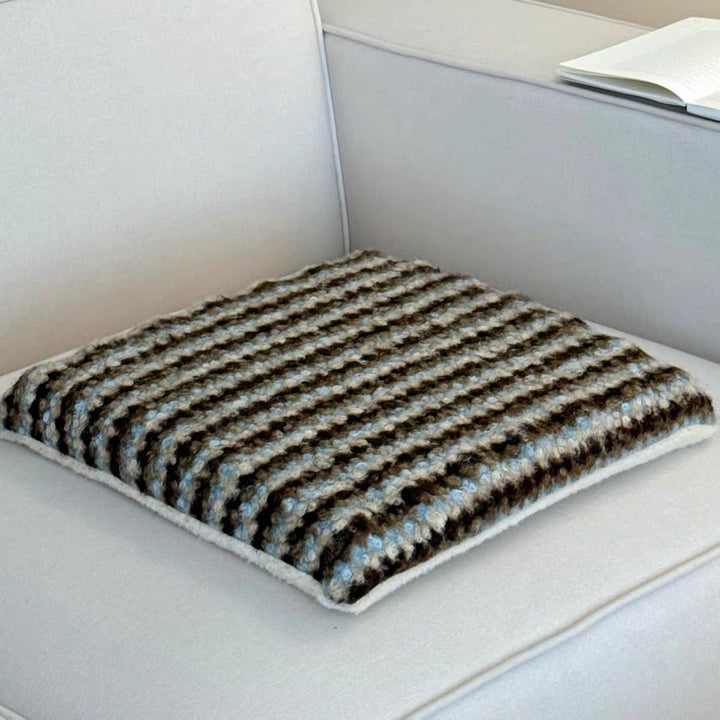 Knitted decorative cushion with wool blend and retro stripe texture