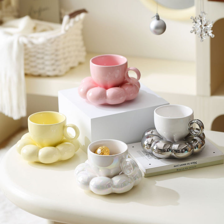 Ceramic mug with sculptural bubble saucer