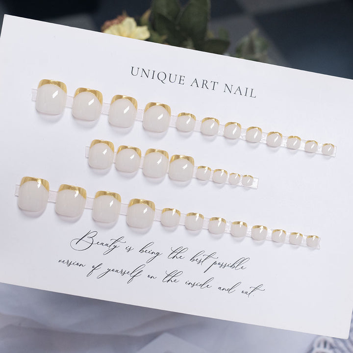 Press-On Nail Art with Elegant Gold Accents