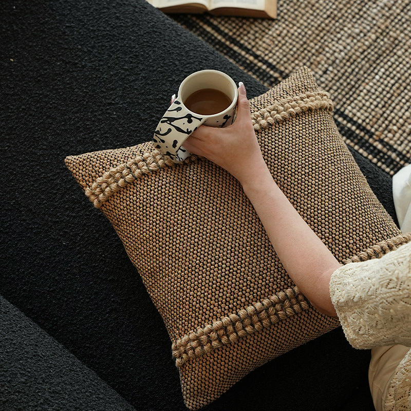 Handwoven structured cushion cover made of cotton blend with pompom trim Kalsten
