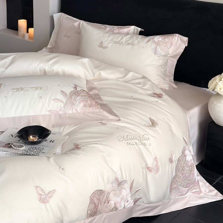 Luxurious satin bedding set with delicate rose and butterfly embroideries