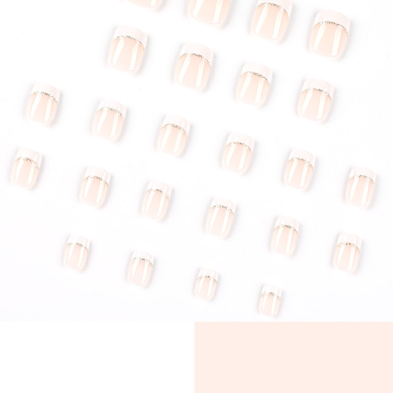 Artful nail extensions with elegant French tip and gold accents Kalsten