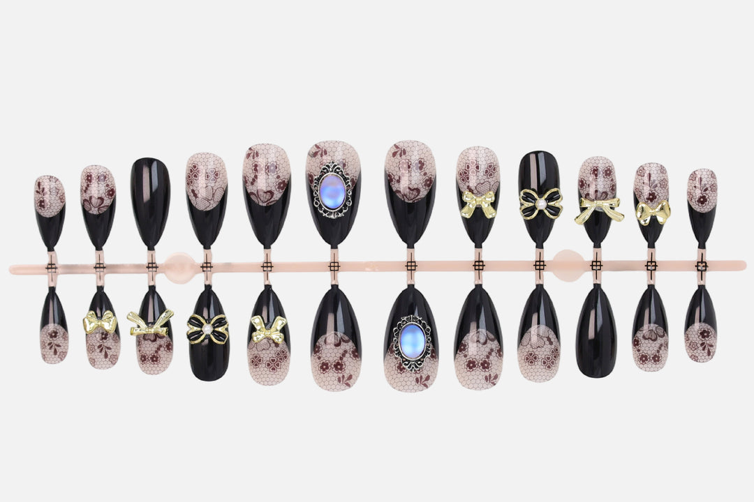 Artificial nail set with elegant dot and bow decorations Kalsten