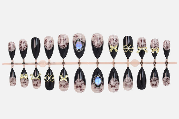 Artificial nail set with elegant dot and bow decorations Kalsten