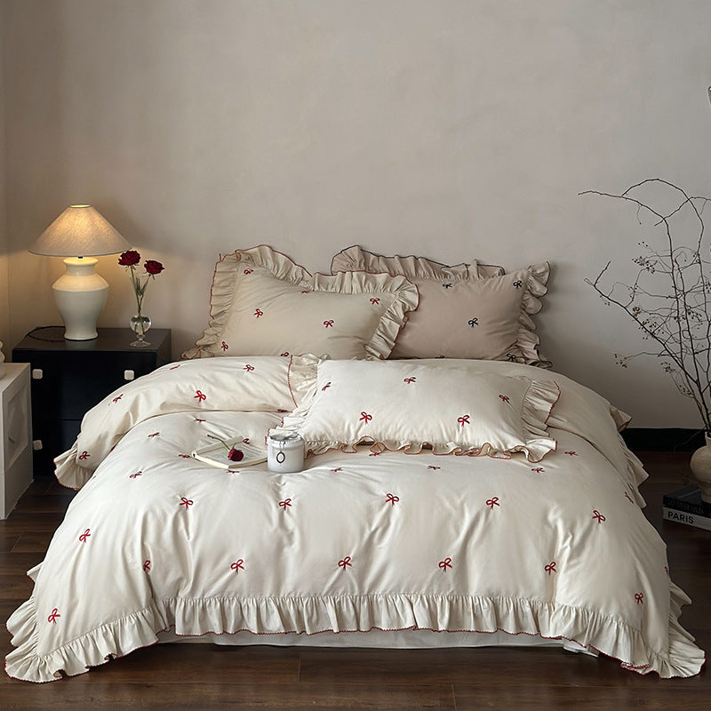 Luxurious bed linen set with ruffles and embroidered bows
