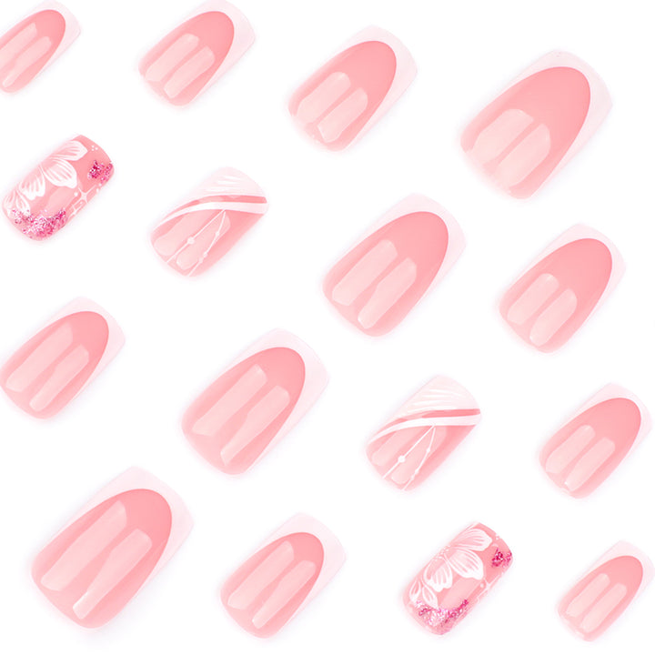 Artful Nail Art with Elegant French Tips and Floral Accents Kalsten