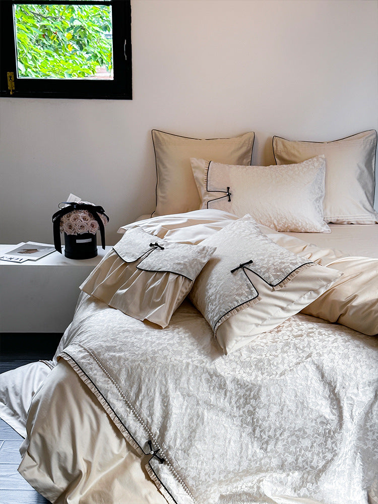 Elegant jacquard bedding set with floral relief structure, ruffles and contrasting piping