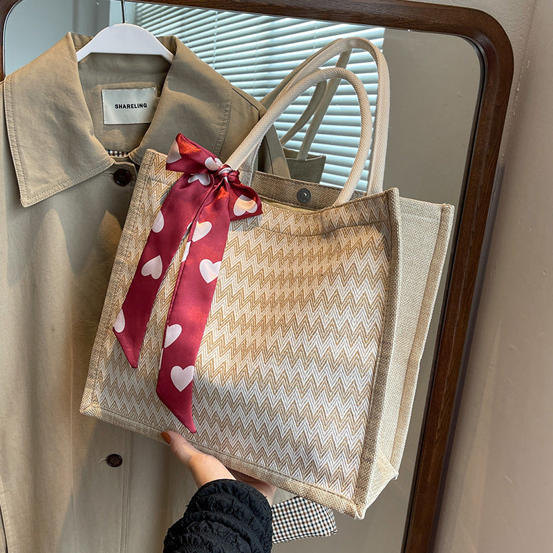 Textured Handbag with Decorative Bow