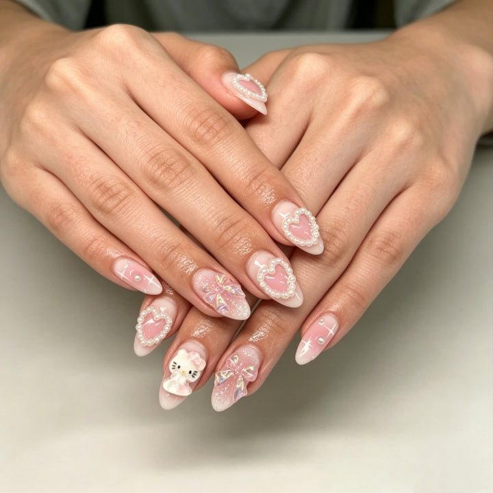 Playful artificial nails with heart and kitty motifs Kalsten