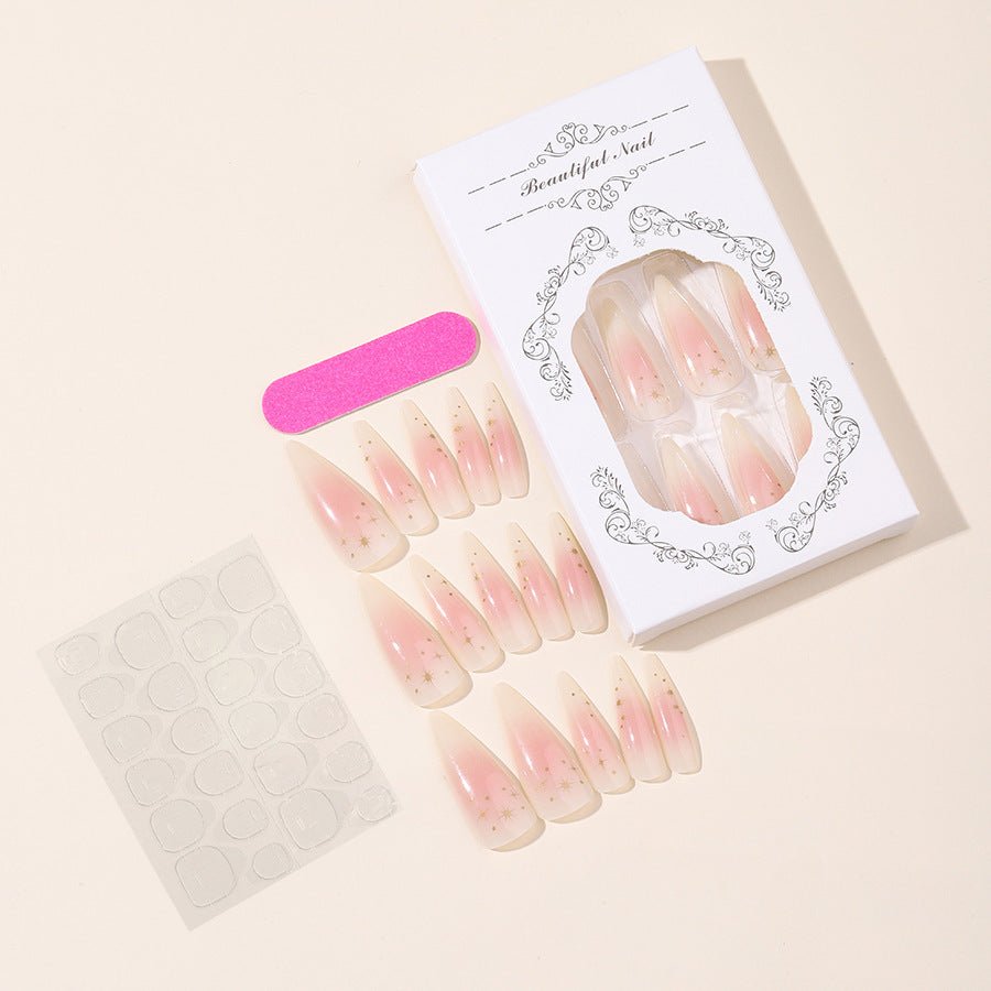Acrylic nail set with delicate ombre design and glamorous star accents Kalsten